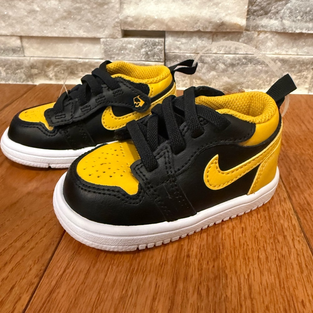 This is a pair of Nike Jordan 1 Low Alt Baby